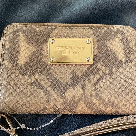 Michael Kors Handbags - Michael Kors Snake Print Wristlet *AS IS see pics lil marks at zipper edge